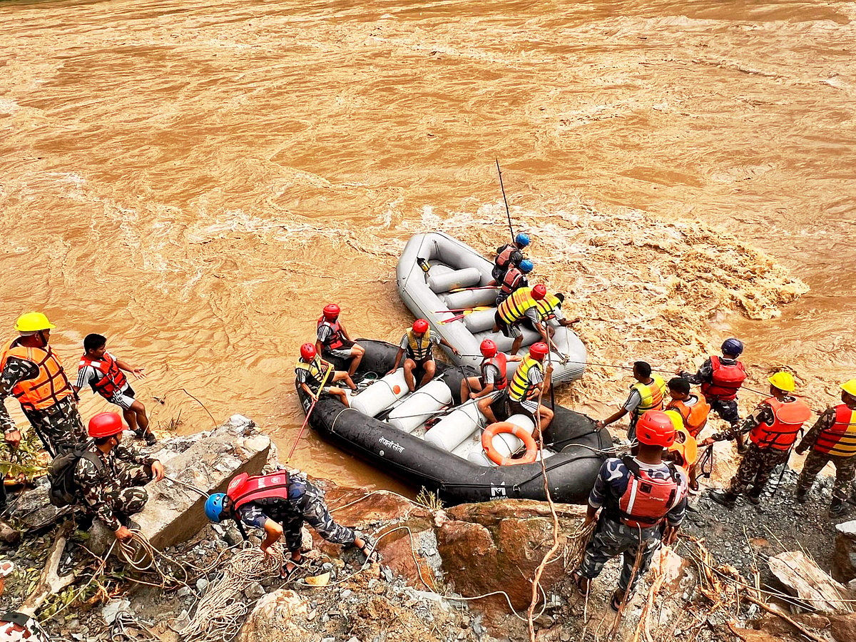 PTI : Rescue operation underway after two buses were swept away by a landslide and pushed into a swollen river at Simaltal area along the Narayanghat-Mugling road in Chitwan district, Nepal. 